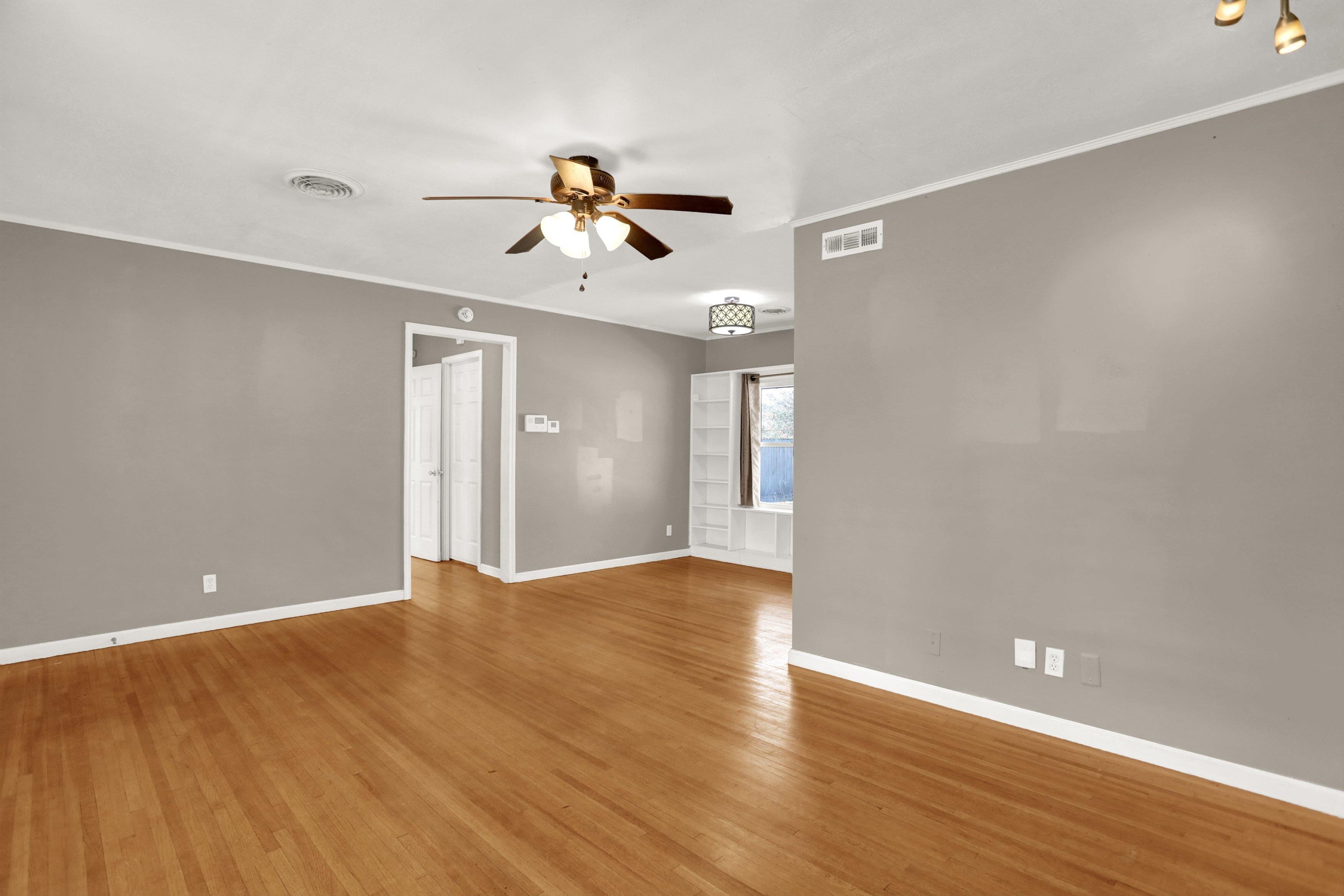 1459 Flamingo Road Memphis, TN 38117 - Photo 18 of 31 a view of empty room with wooden floor and fan