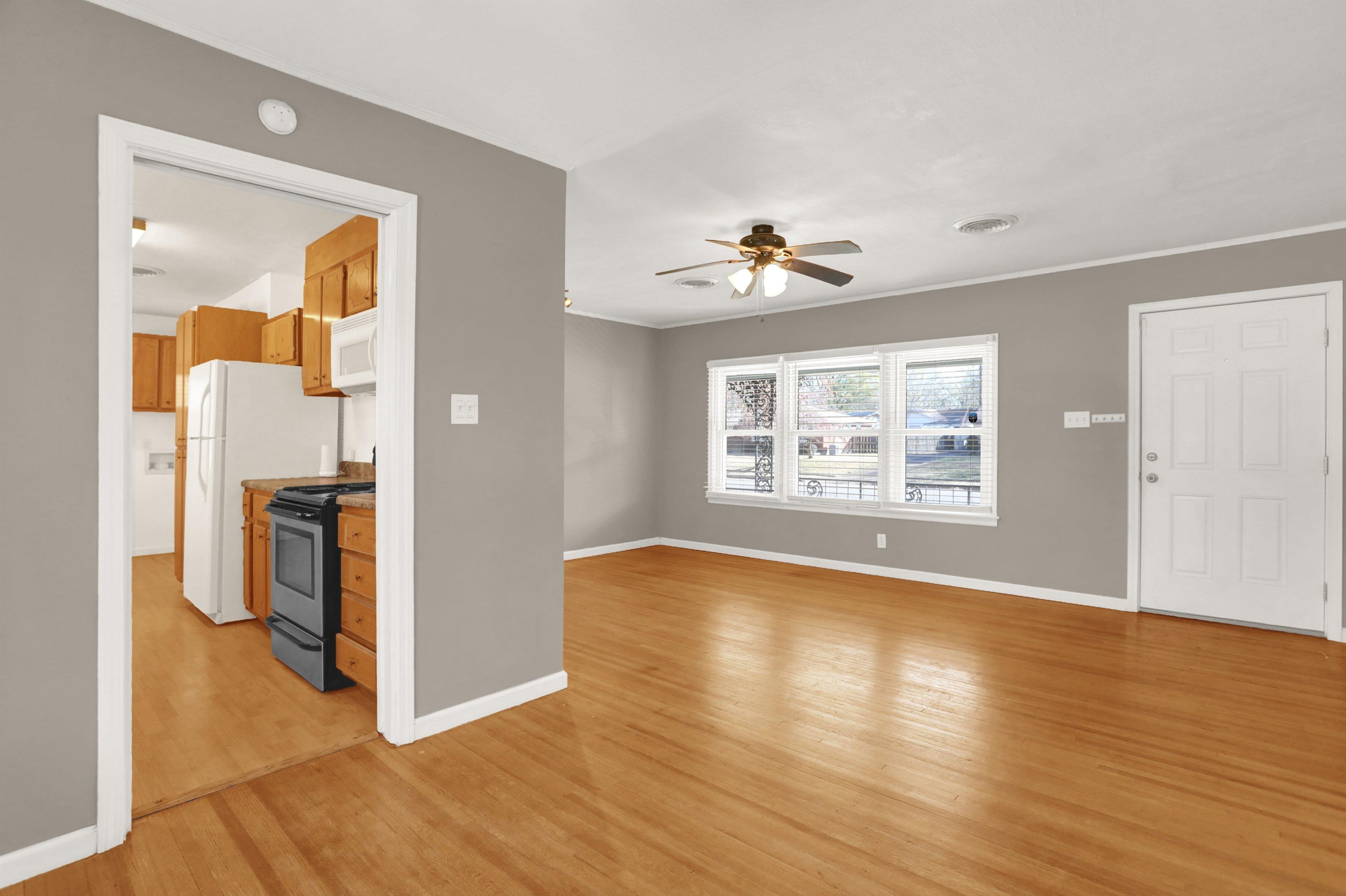 1459 Flamingo Road Memphis, TN 38117 - Photo 21 of 31 a view of an empty room with window and wooden floor