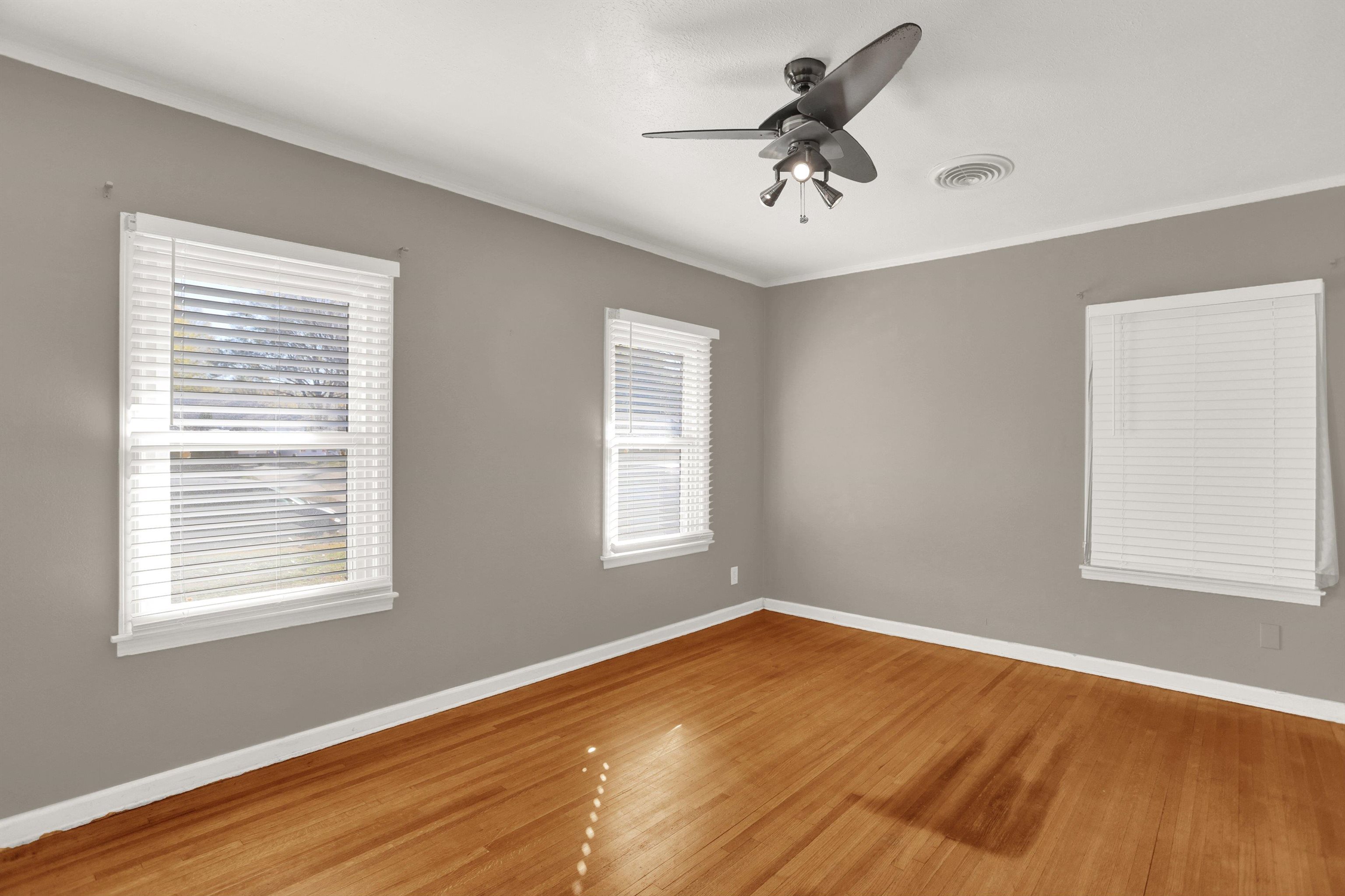 1459 Flamingo Road Memphis, TN 38117 - Photo 23 of 31 a view of empty room with wooden floor and fan