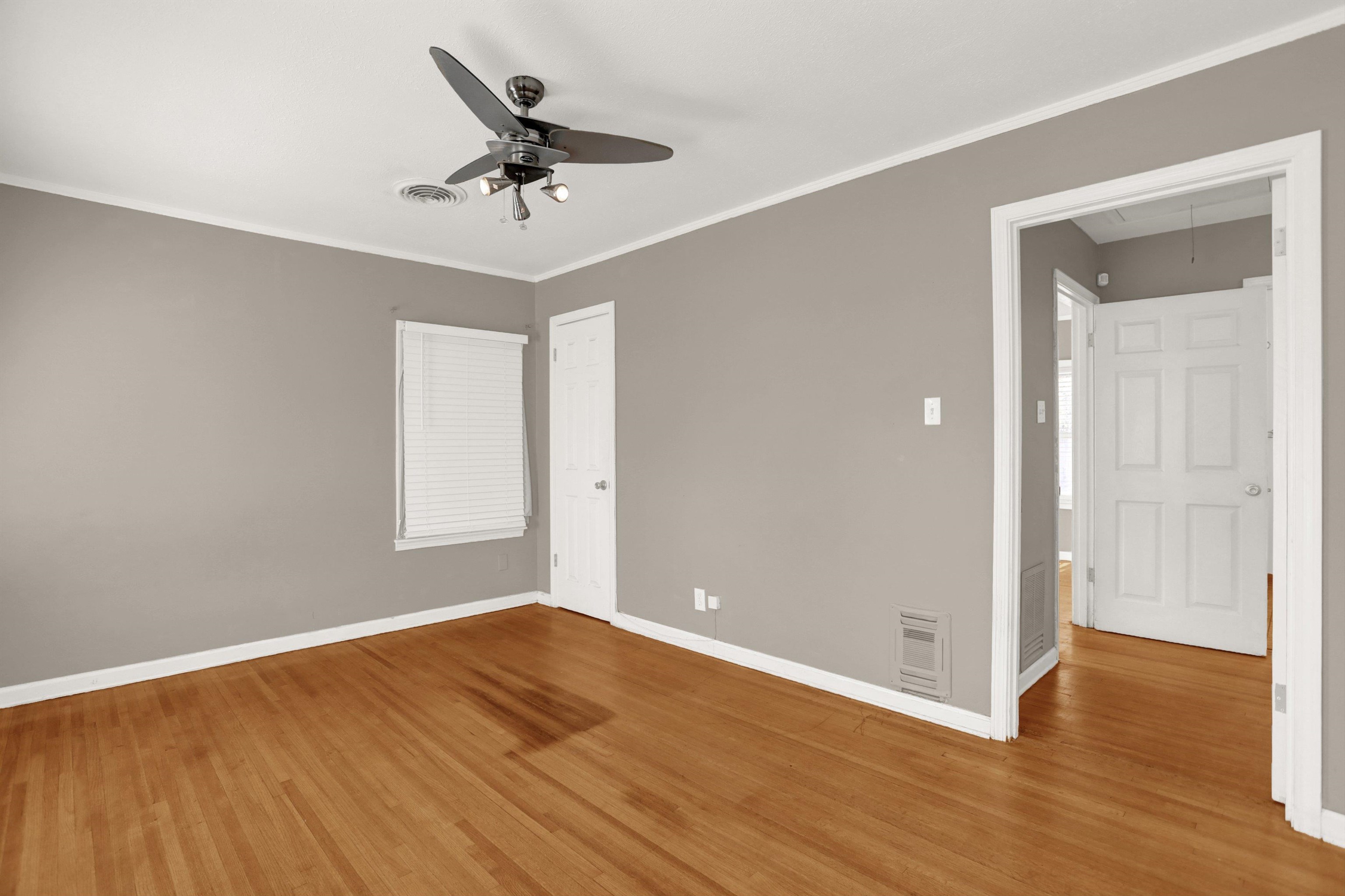 1459 Flamingo Road Memphis, TN 38117 - Photo 26 of 31 wooden floor in an empty room with a window