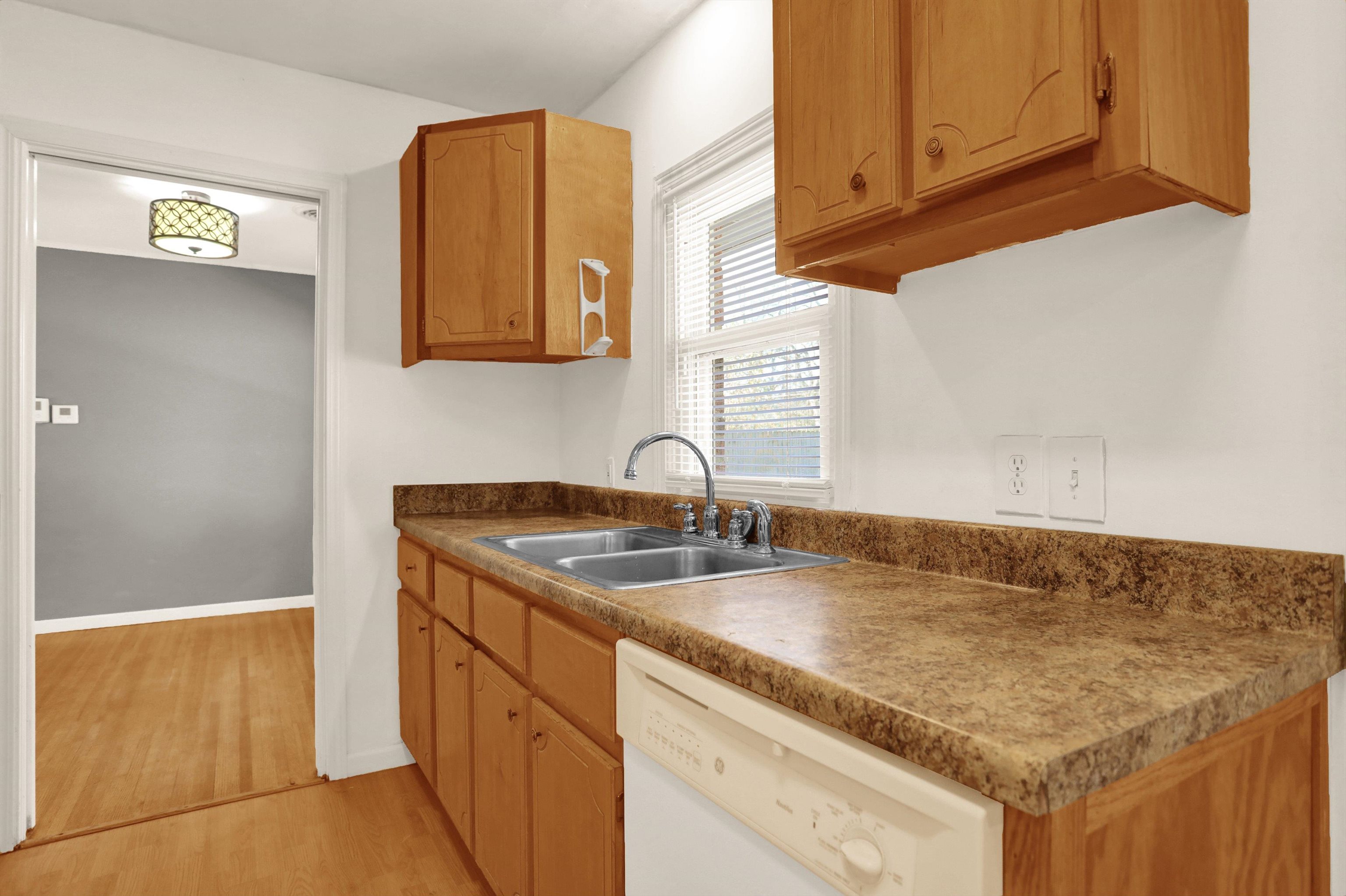 1459 Flamingo Road Memphis, TN 38117 - Photo 10 of 31 a kitchen with sink cabinets and a window