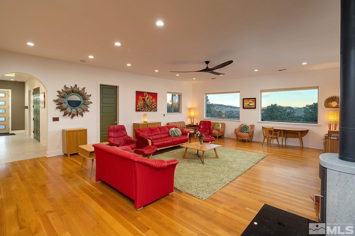 21635 Delta Drive Reno, NV 89521 - Photo 11 of 27 a living room with furniture and a flat screen tv