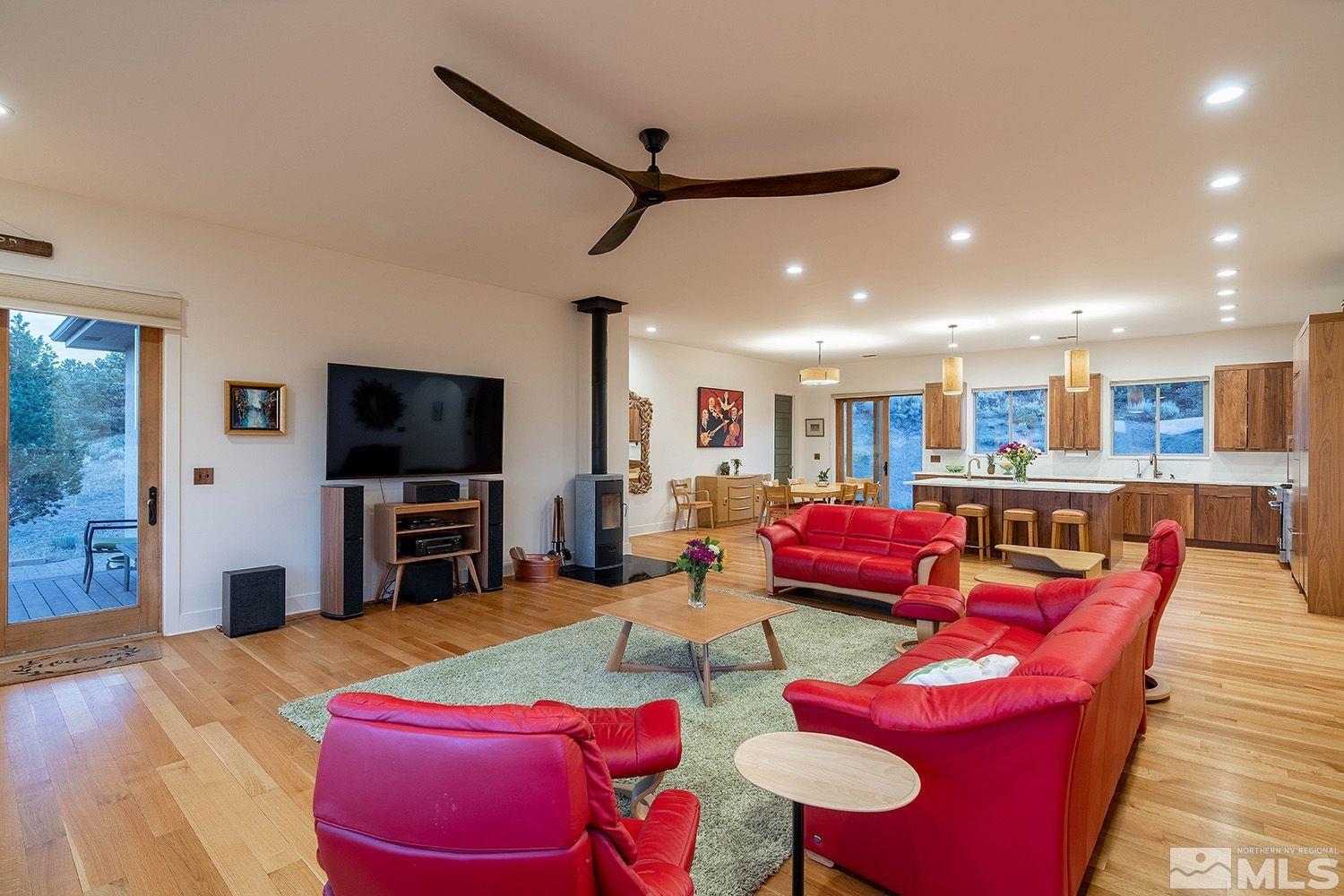 21635 Delta Drive Reno, NV 89521 - Photo 14 of 27 a living room with furniture and a flat screen tv