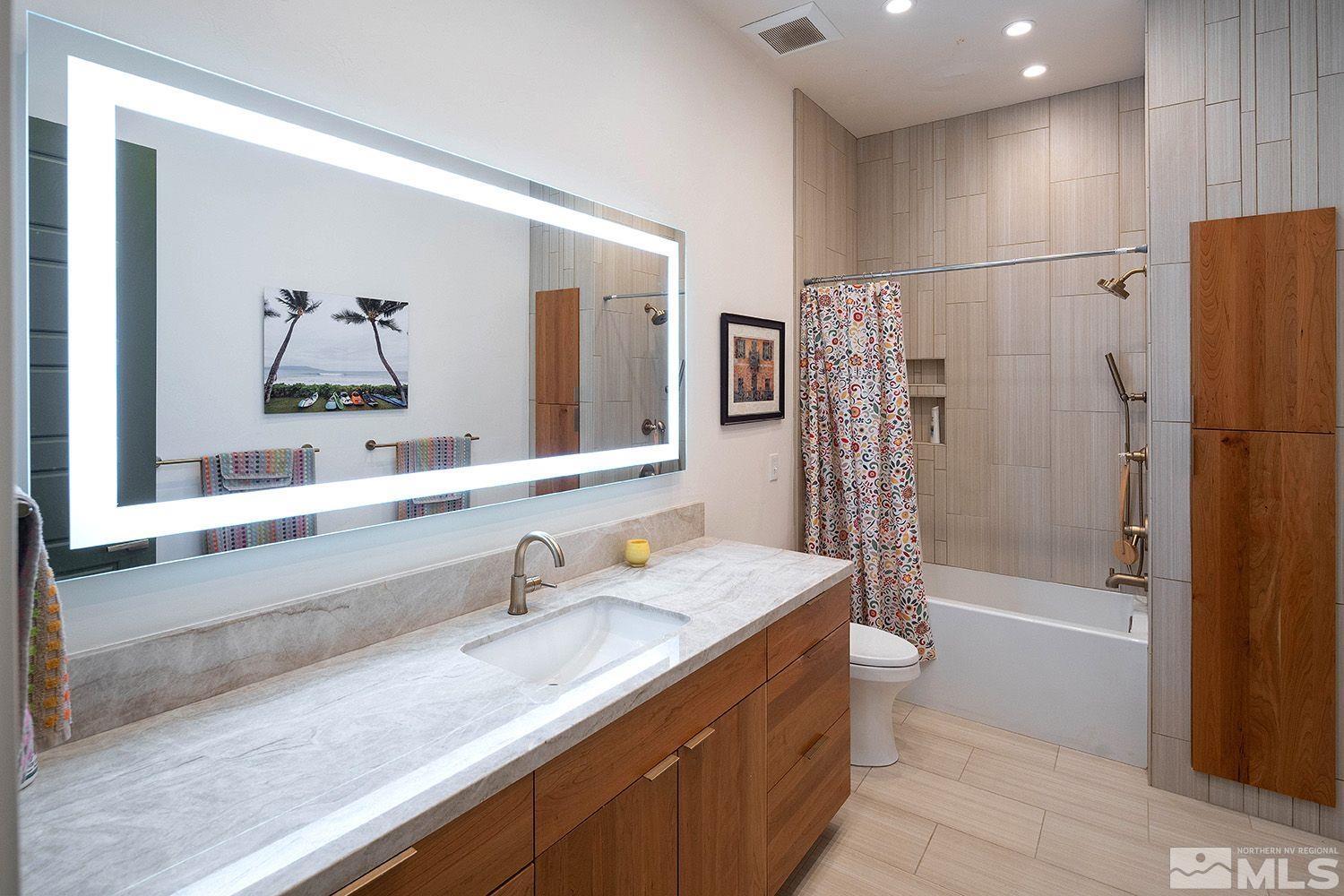 21635 Delta Drive Reno, NV 89521 - Photo 17 of 27 a bathroom with a tub sink and mirror