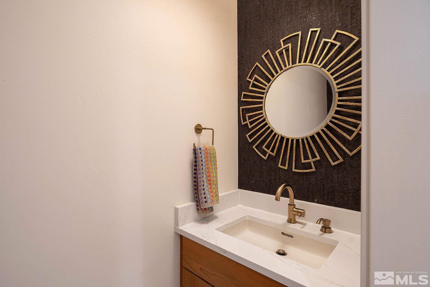 21635 Delta Drive Reno, NV 89521 - Photo 18 of 27 a bathroom with a sink and a mirror