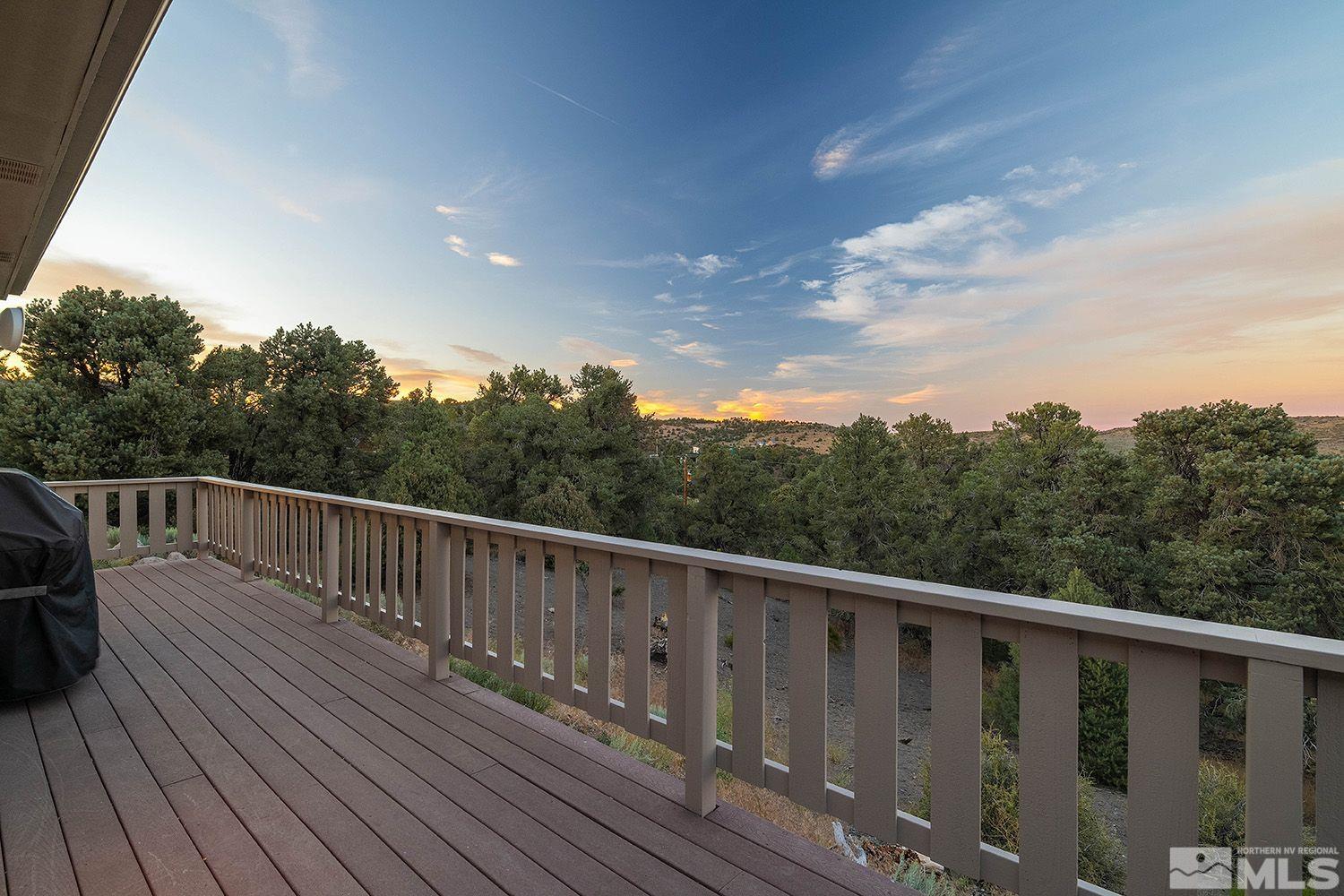 21635 Delta Drive Reno, NV 89521 - Photo 25 of 27 a balcony with wooden floor and fence