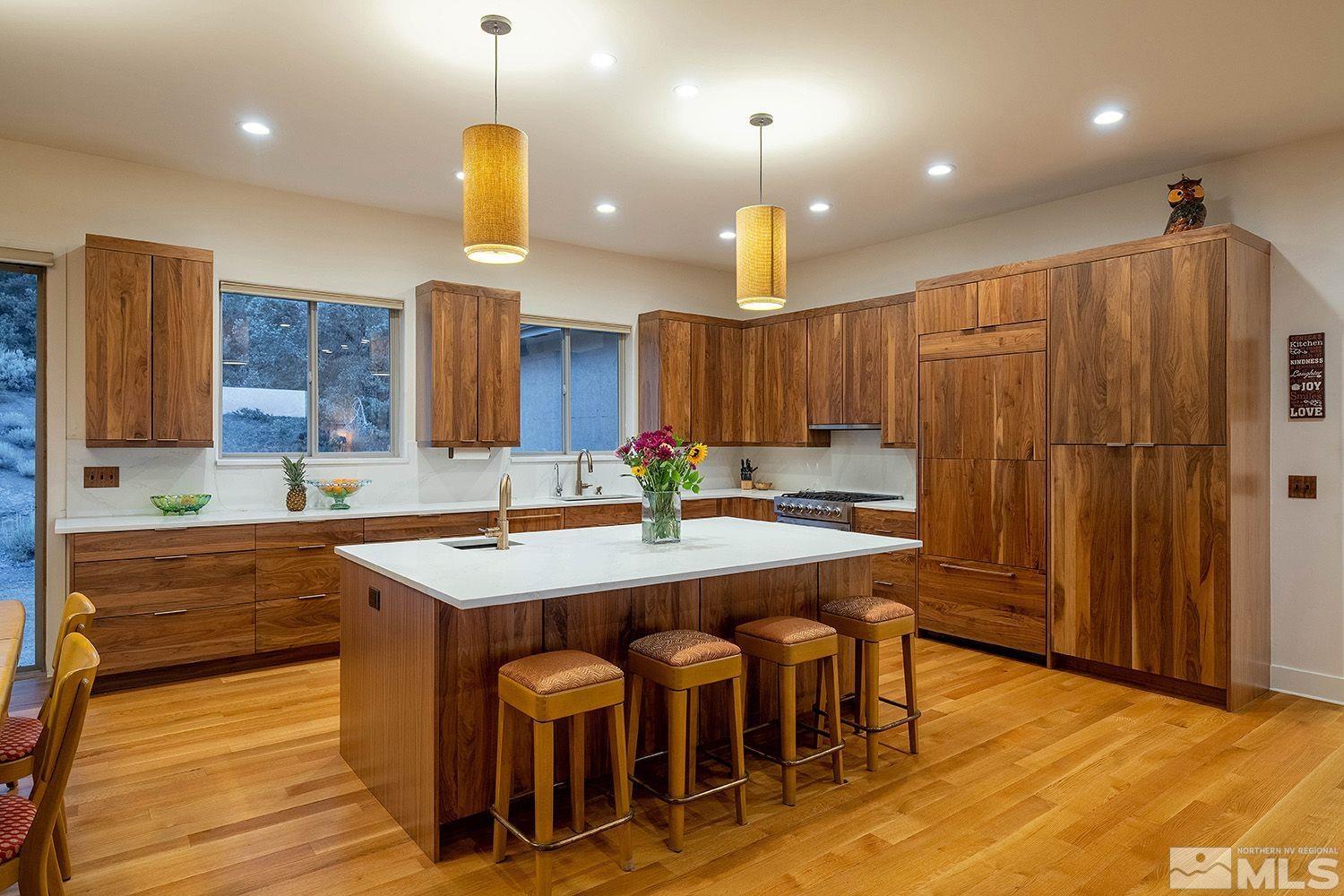 21635 Delta Drive Reno, NV 89521 - Photo 3 of 27 an open kitchen with a table and chairs in it