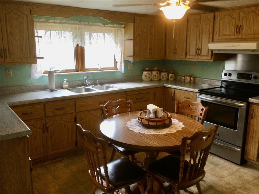 1133 Brush Run Road Washington, PA 15301 - Photo 3 of 19 a kitchen with a table chairs stove and cabinets