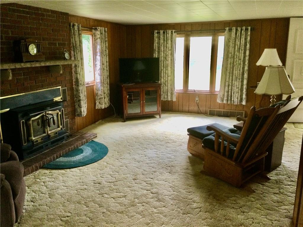 1133 Brush Run Road Washington, PA 15301 - Photo 6 of 19 a living room with furniture flat screen tv and a fireplace