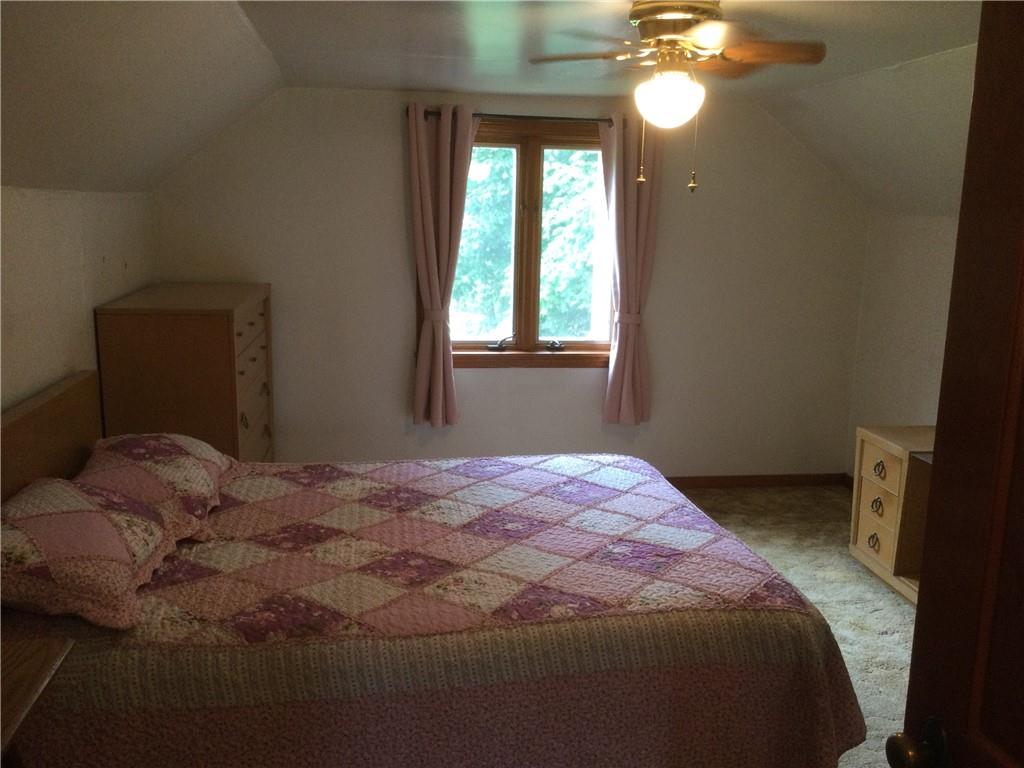 1133 Brush Run Road Washington, PA 15301 - Photo 7 of 19 a bedroom with a bed and a chandelier