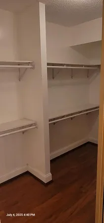 a view of an empty walk in closet