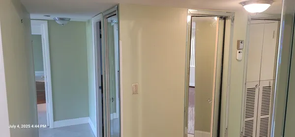 a bathroom with a shower and a glass door