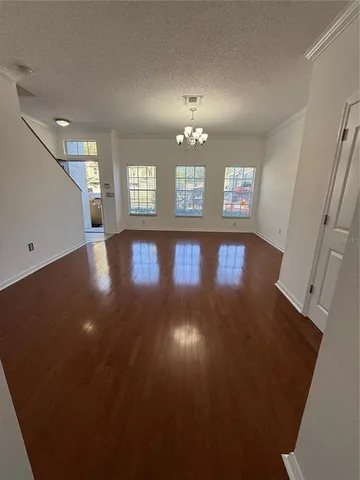 a view of a livingroom with wooden floor