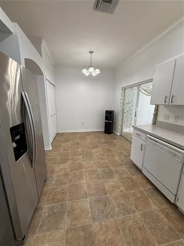 a kitchen with stainless steel appliances a refrigerator sink and stove