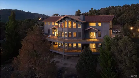 a front view of a house with a small yard