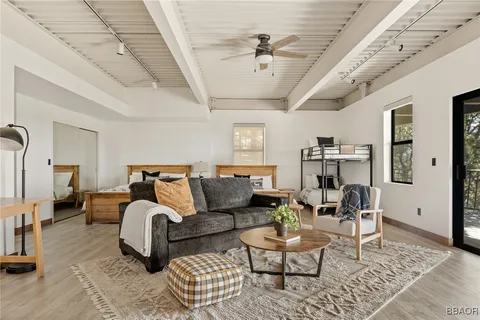 a bed room with furniture and a chandelier