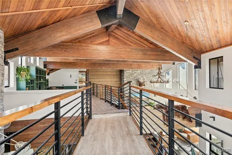 a view of balcony with wooden floor