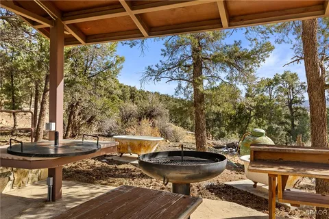 a view of a two chairs in the patio