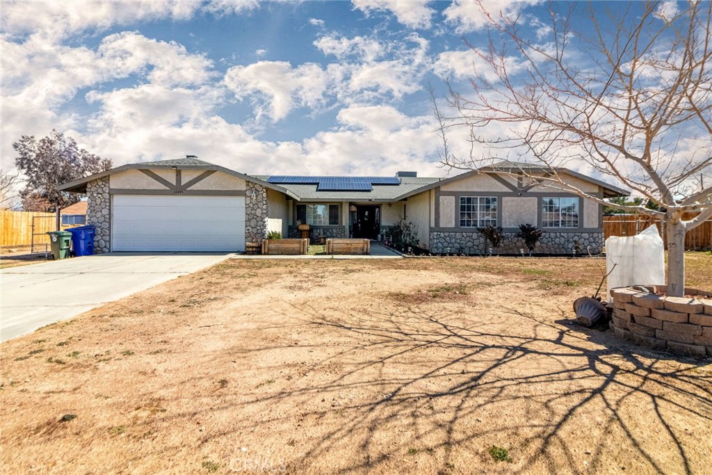 12291 Tesuque Road Apple Valley, CA 92308 - Photo 1 of 1 a front view of a house with a yard covered with snow