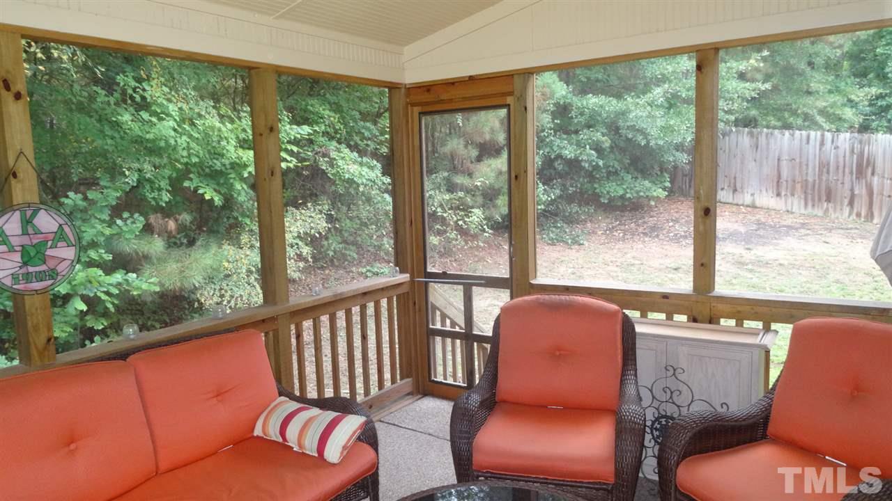 7908 Old Mill Ridge Court Raleigh, NC 27616 - Photo 14 of 17 a blue chair sitting in front of a window