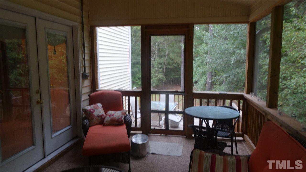 7908 Old Mill Ridge Court Raleigh, NC 27616 - Photo 15 of 17 a balcony with furniture and wooden floor