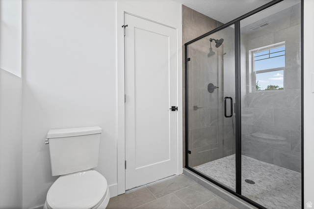 340 East 7635 S Street Sandy, UT 84047 - Photo 18 of 32 Full bath featuring a stall shower and light tile patterned floors