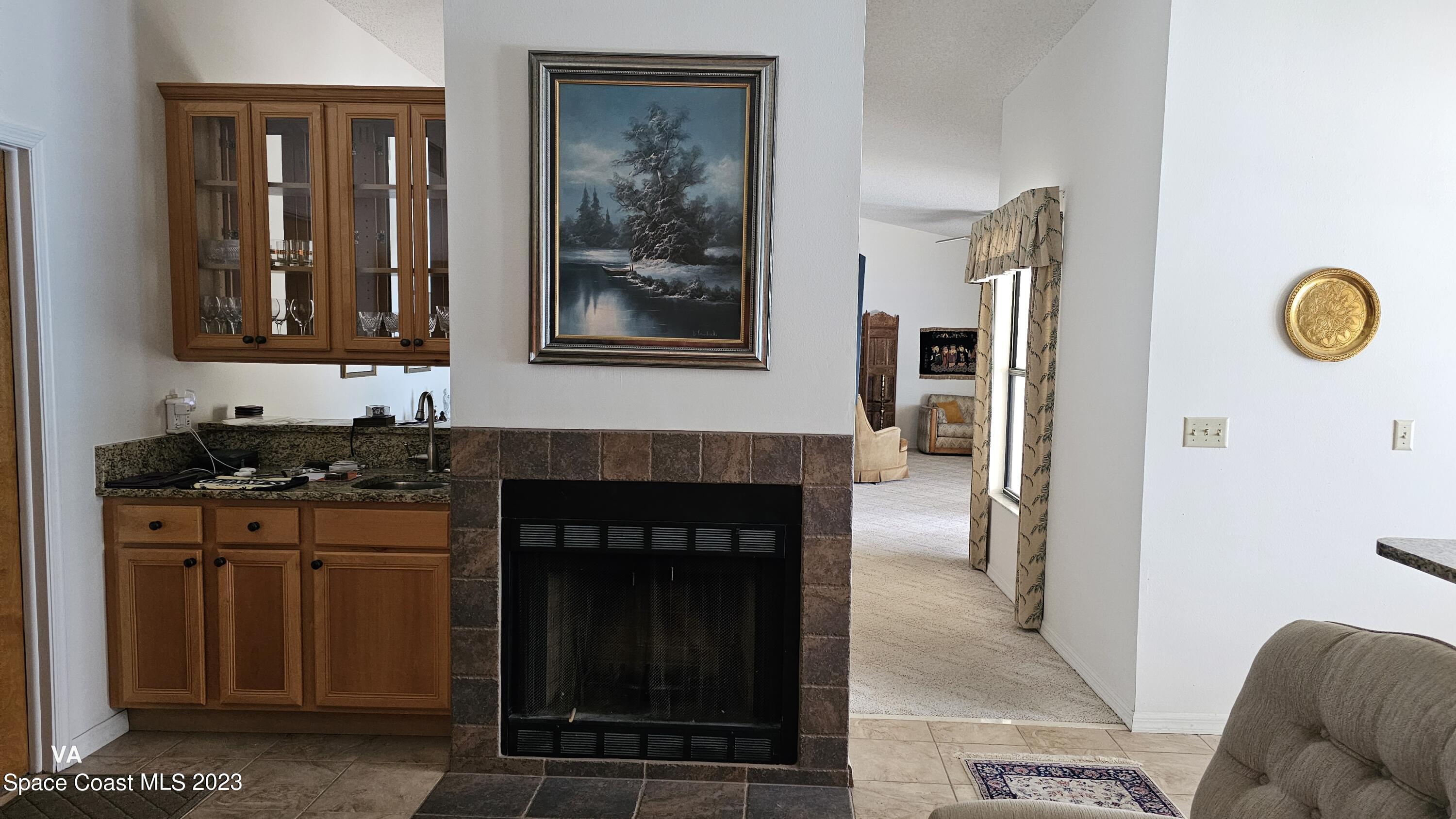 329 Pine Ridge Lane Melbourne, FL 32940 - Photo 10 of 30 wet bar and fire place
