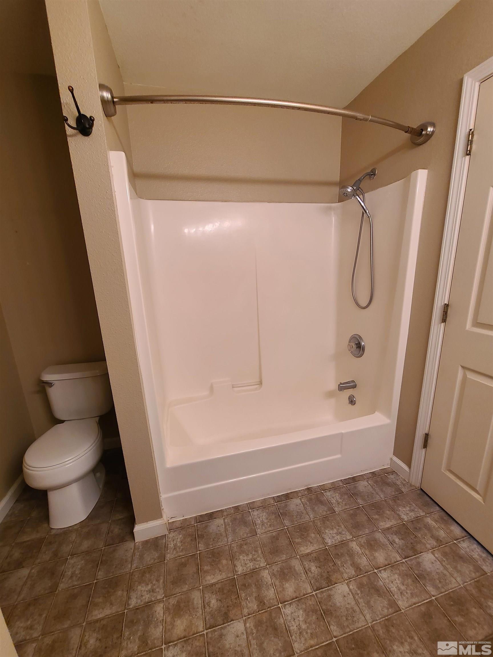 2760 Dallas Drive Fallon, NV 89406 - Photo 18 of 33 a bathroom with a shower and toilet