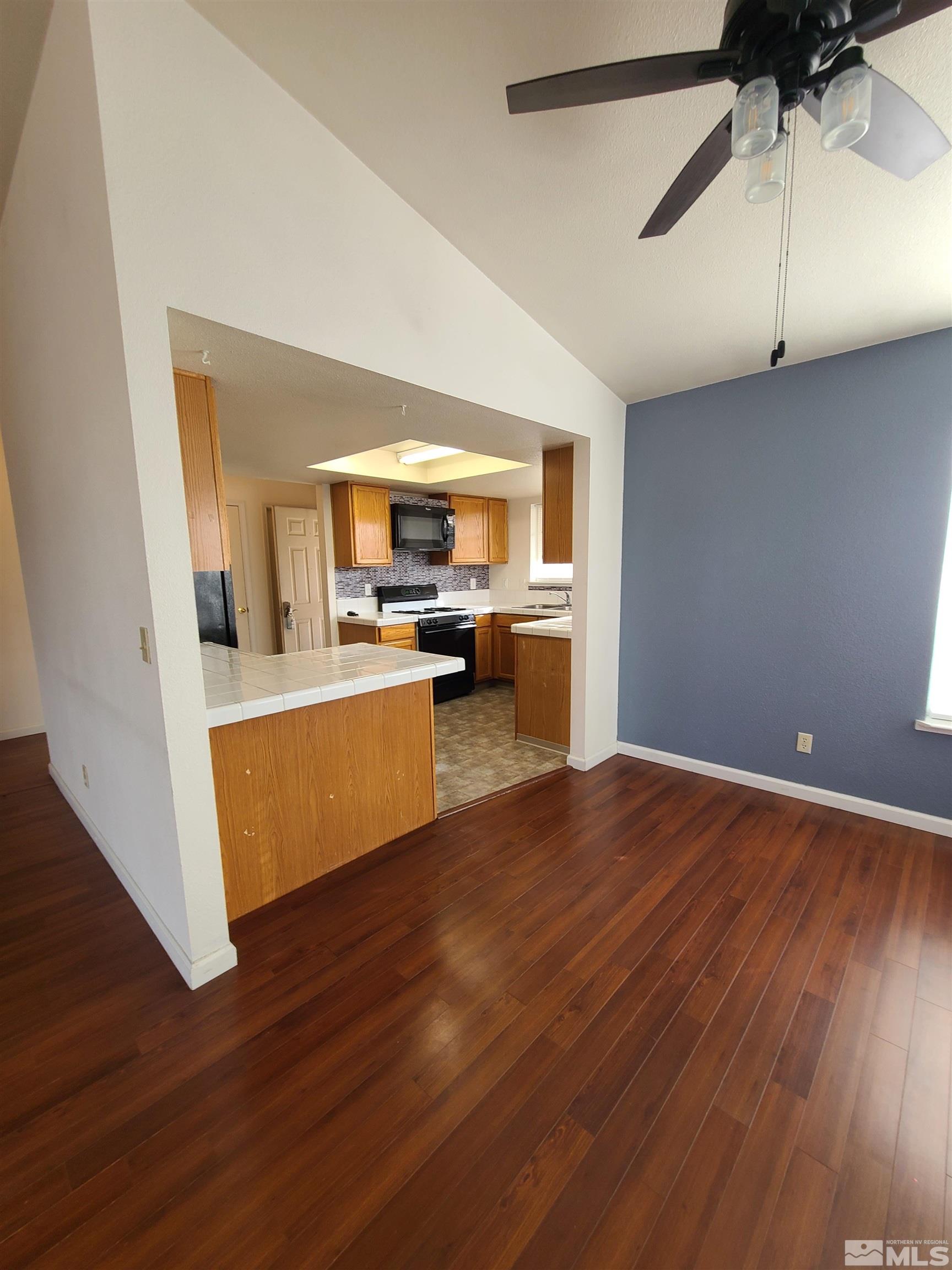 2760 Dallas Drive Fallon, NV 89406 - Photo 6 of 33 a view of a kitchen with wooden floor and a window