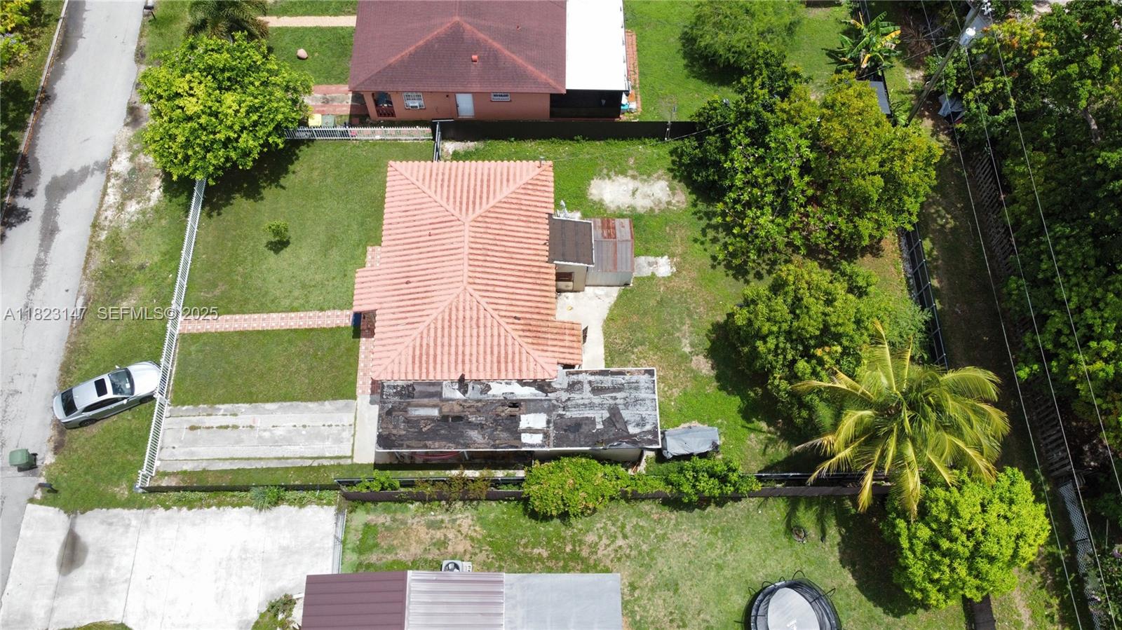926 Northwest 3rd Avenue Homestead, FL 33030 - Photo 19 of 23 an aerial view of a house with a yard
