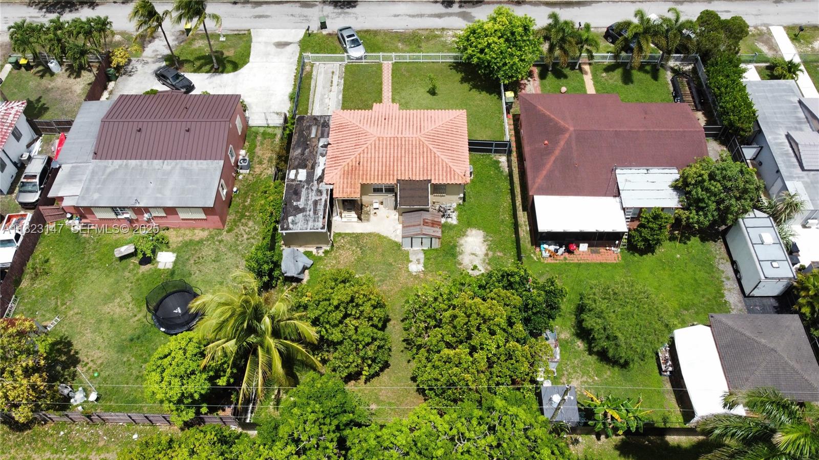 926 Northwest 3rd Avenue Homestead, FL 33030 - Photo 20 of 23 an aerial view of multiple houses with yard