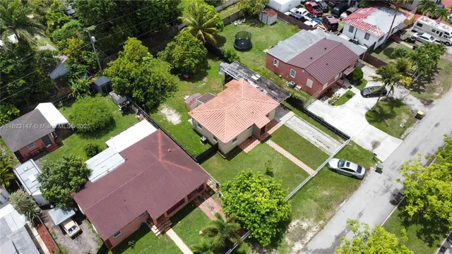 an aerial view of a house with a garden