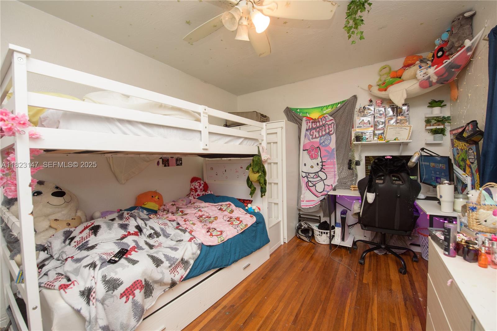 926 Northwest 3rd Avenue Homestead, FL 33030 - Photo 9 of 23 a bedroom with bed and a wooden floor