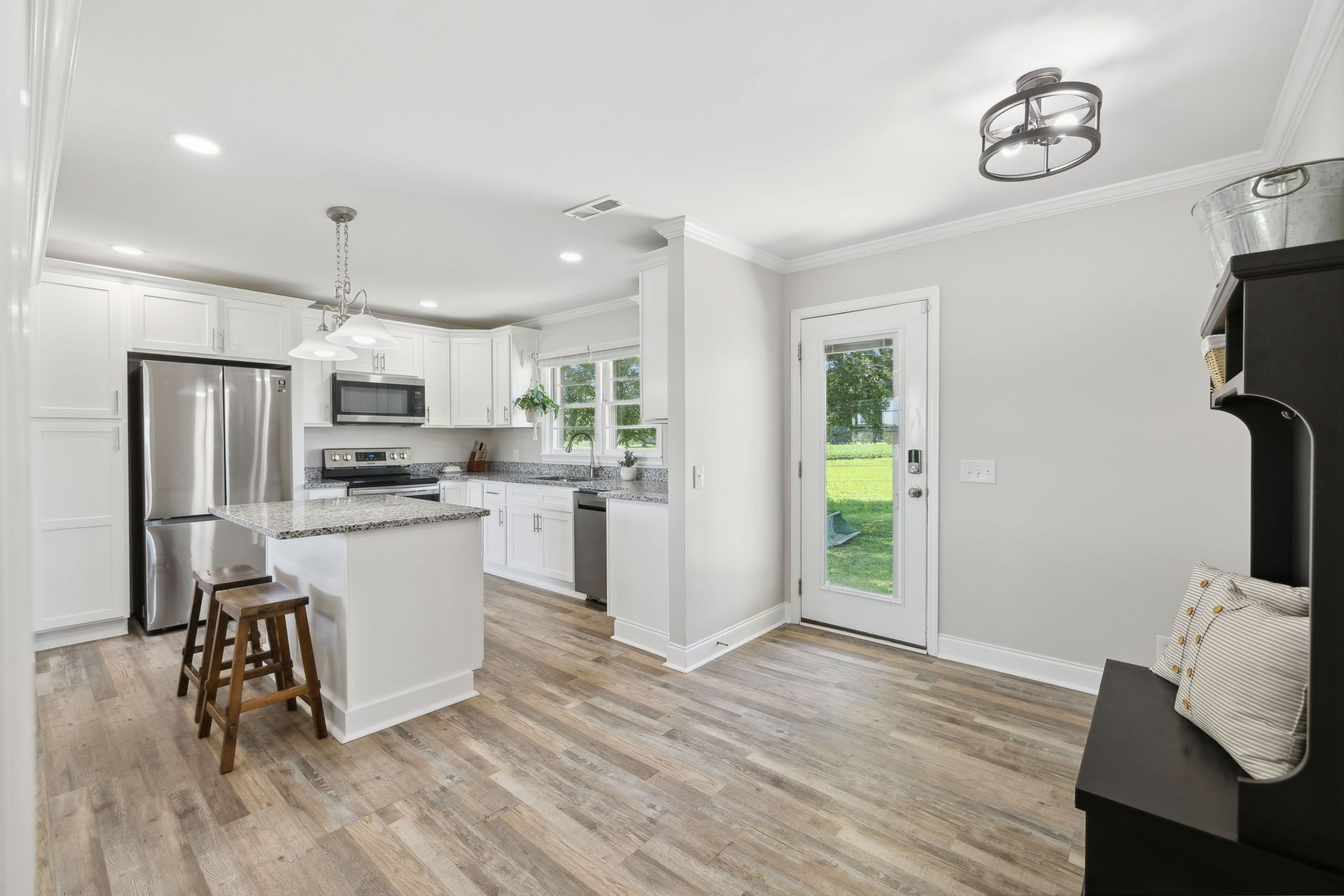40 Yates Road Hillsboro, TN 37342 - Photo 13 of 39 a kitchen with white cabinets and stainless steel appliances