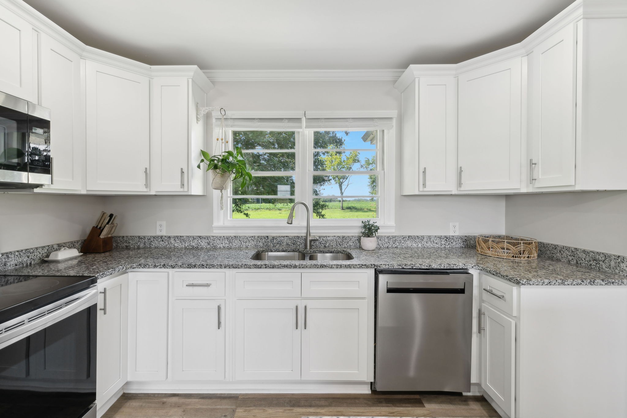 40 Yates Road Hillsboro, TN 37342 - Photo 15 of 39 a kitchen with granite countertop white cabinets and a stove