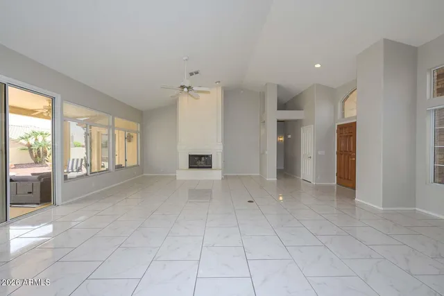 a view of an empty room and a window