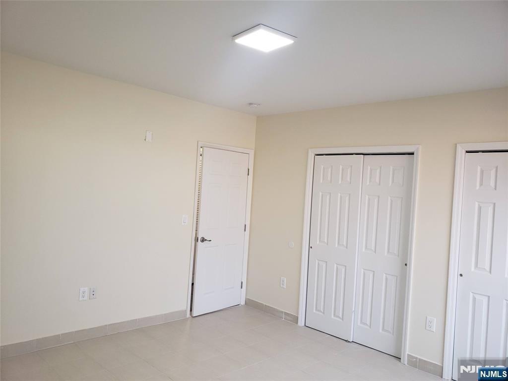 44 Bergen Boulevard, Unit 9 Fairview, NJ 07022 - Photo 16 of 16 an empty room with closet area