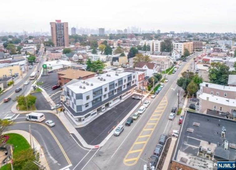 44 Bergen Boulevard, Unit 9 Fairview, NJ 07022 - Photo 2 of 16 a city view with tall buildings