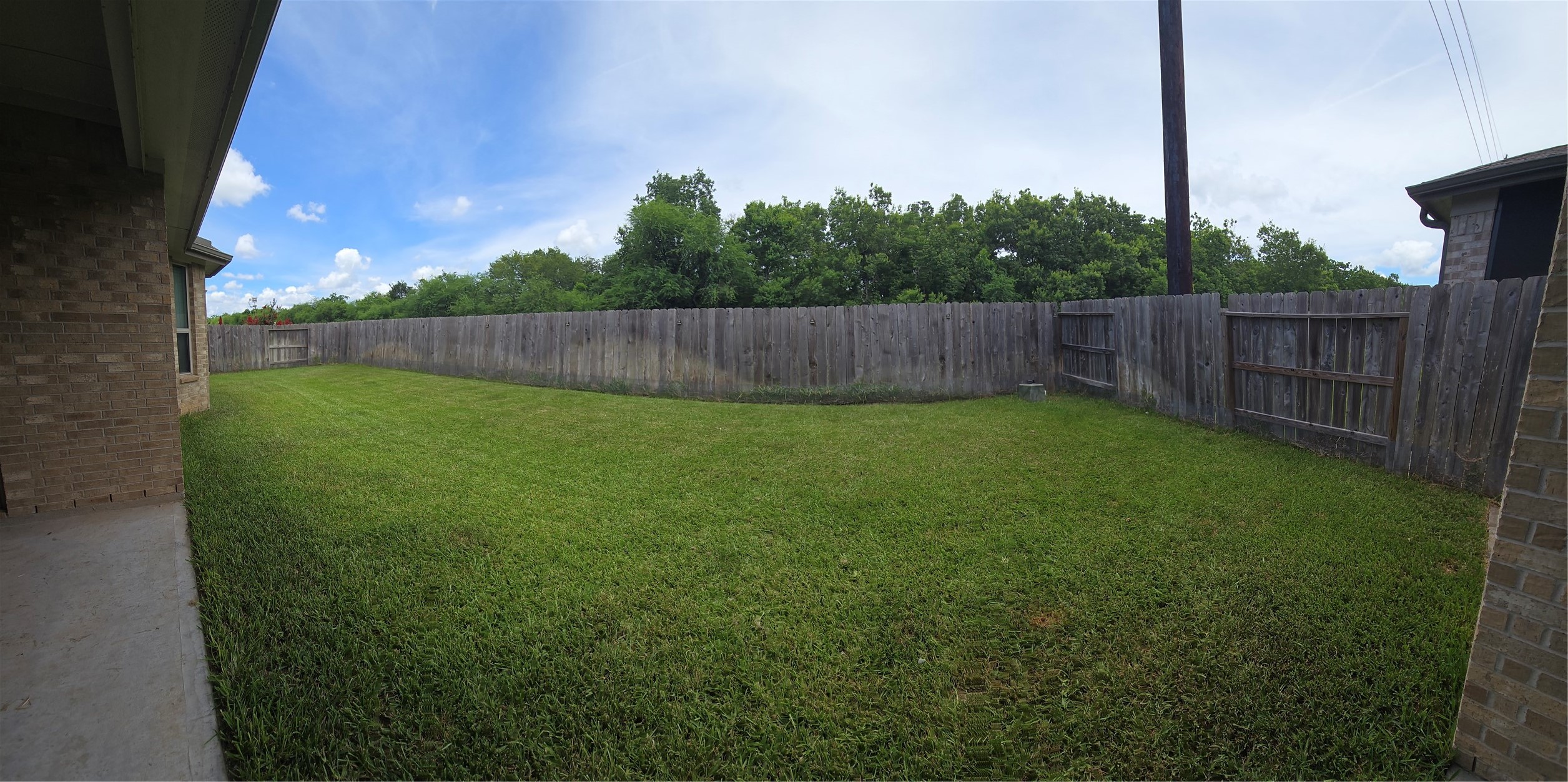 5035 Sierra Ridge Drive Rosenberg, TX 77469 - Photo 22 of 26 Discover the serenity of a lush, well-maintained backyard, perfect for relaxation and outdoor gatherings.