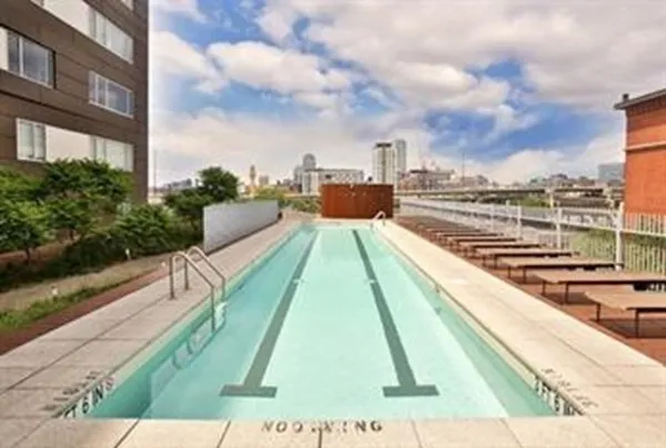 a view of a swimming pool with a lounge chairs