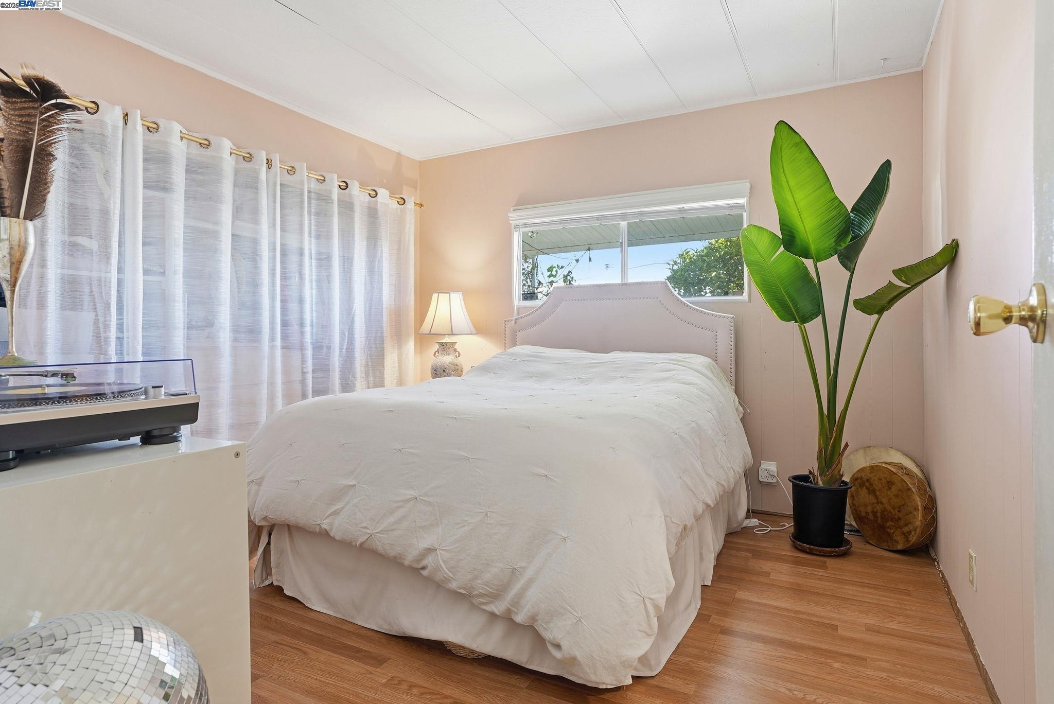 4141 Deep Creek Road, Unit 89 Fremont, CA 94555 - Photo 24 of 54 a bedroom with a bed and a window