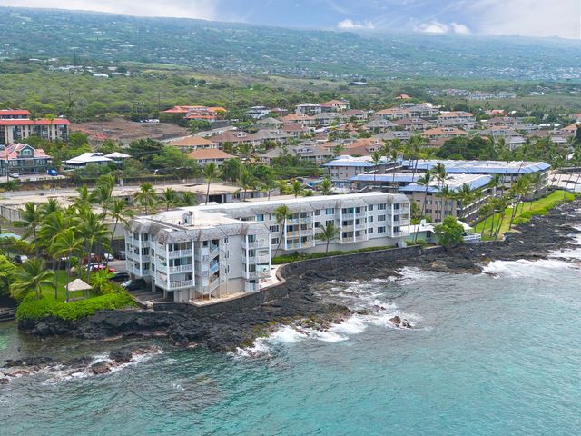 an aerial view of a house with a garden