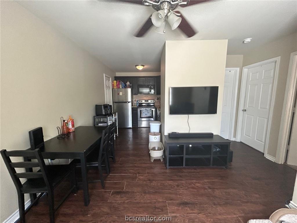 305 Ehlinger Drive, Unit D Bryan, TX 77801 - Photo 2 of 11 a living room with furniture and a flat screen tv