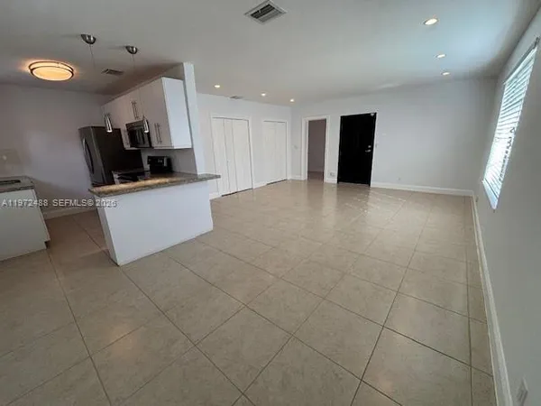 a view of a kitchen with a sink