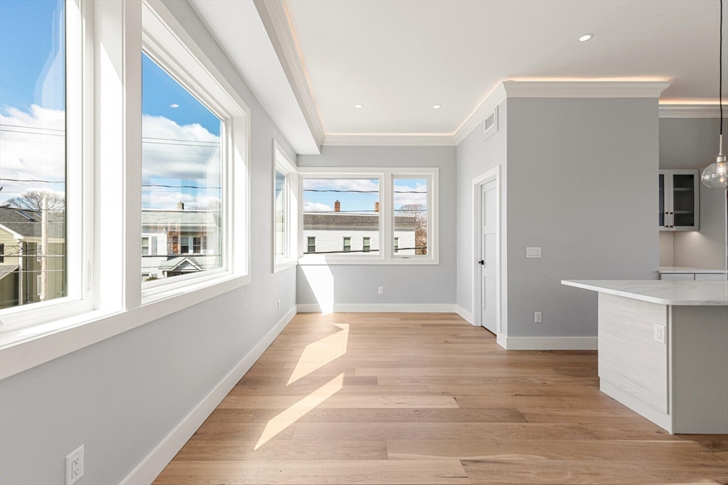 308 Newton Street, Unit 1F Waltham, MA 02453 - Photo 17 of 37 a view of a kitchen with a sink and a window