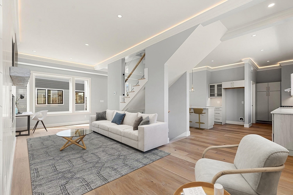 308 Newton Street, Unit 1F Waltham, MA 02453 - Photo 26 of 37 a living room with furniture and a large window