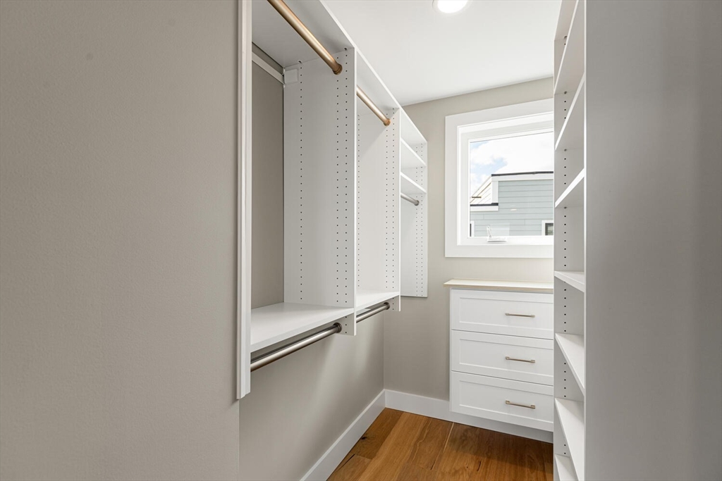308 Newton Street, Unit 1F Waltham, MA 02453 - Photo 33 of 37 a view of walk in closet with empty racks