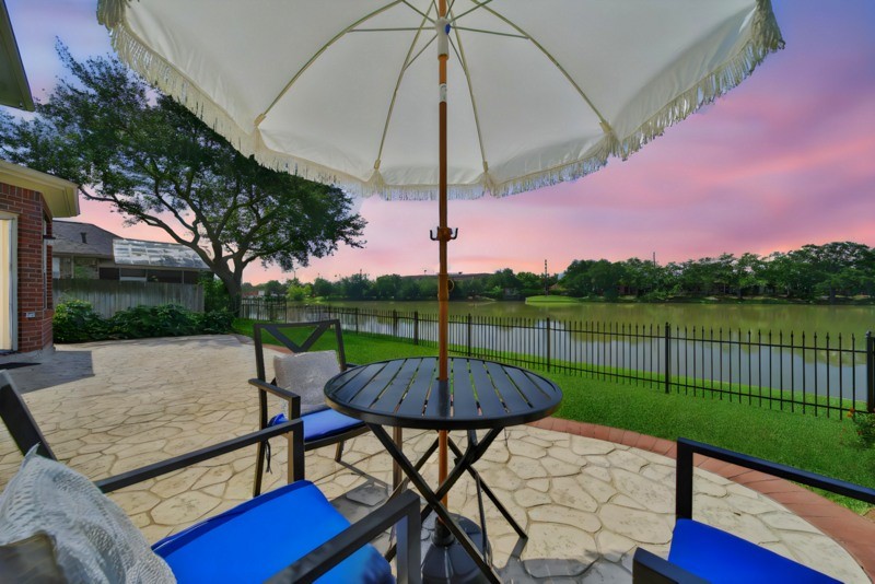 3206 Summer Bay Drive Sugar Land, TX 77478 - Photo 26 of 43 a view of a patio with a table chairs couches and a fire pit