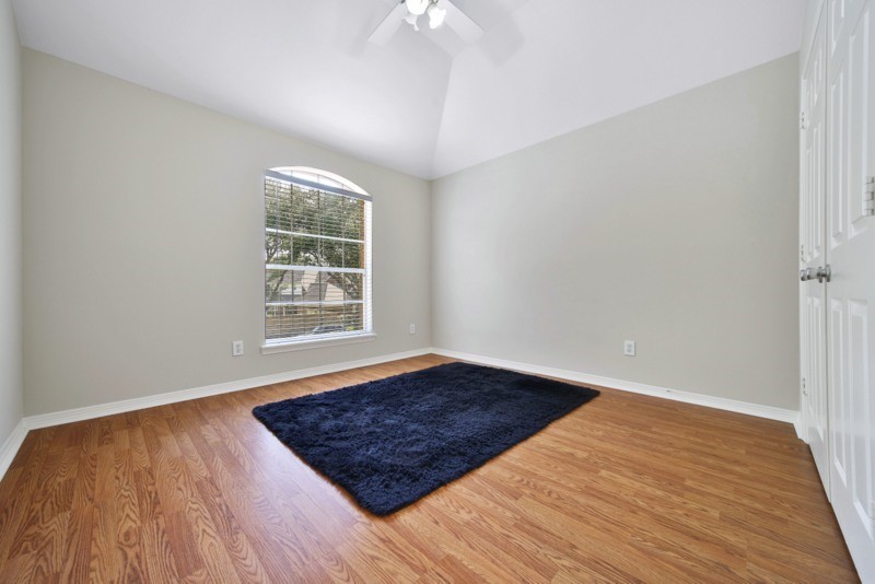 3206 Summer Bay Drive Sugar Land, TX 77478 - Photo 31 of 43 a view of an empty room with wooden floor and a window