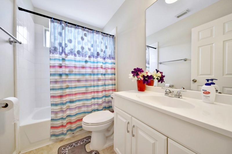 3206 Summer Bay Drive Sugar Land, TX 77478 - Photo 32 of 43 a bathroom with a sink a toilet and shower curtain